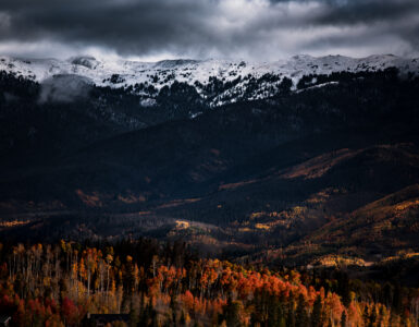 Autumn-colored hills and mountains under clear daylight