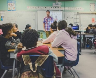 Students learning in a classroom where air quality can affect comfort and focus
