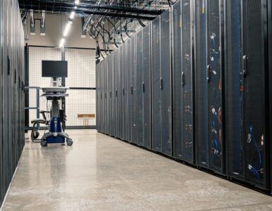 Rows of server racks representing the remote computing resources behind cloud services.