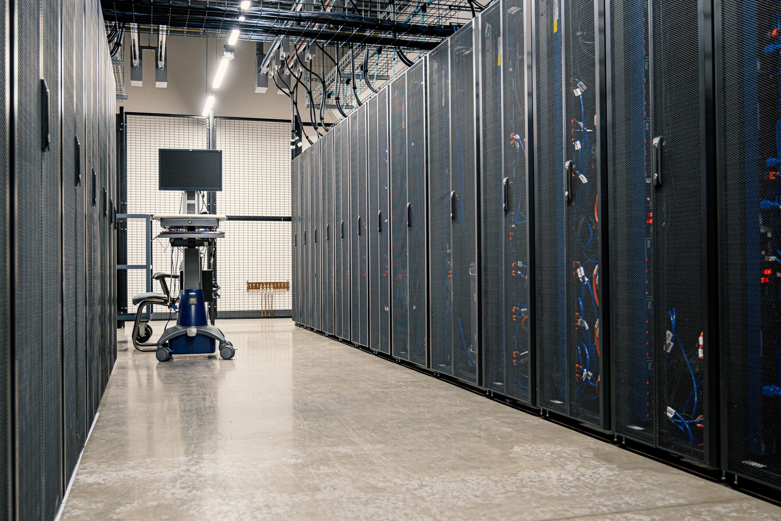 Rows of data center equipment representing shared infrastructure used by many cloud applications.