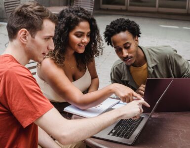 Students reviewing college census date and financial aid deadlines on a laptop