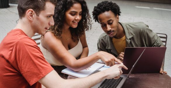 Students reviewing college census date and financial aid deadlines on a laptop
