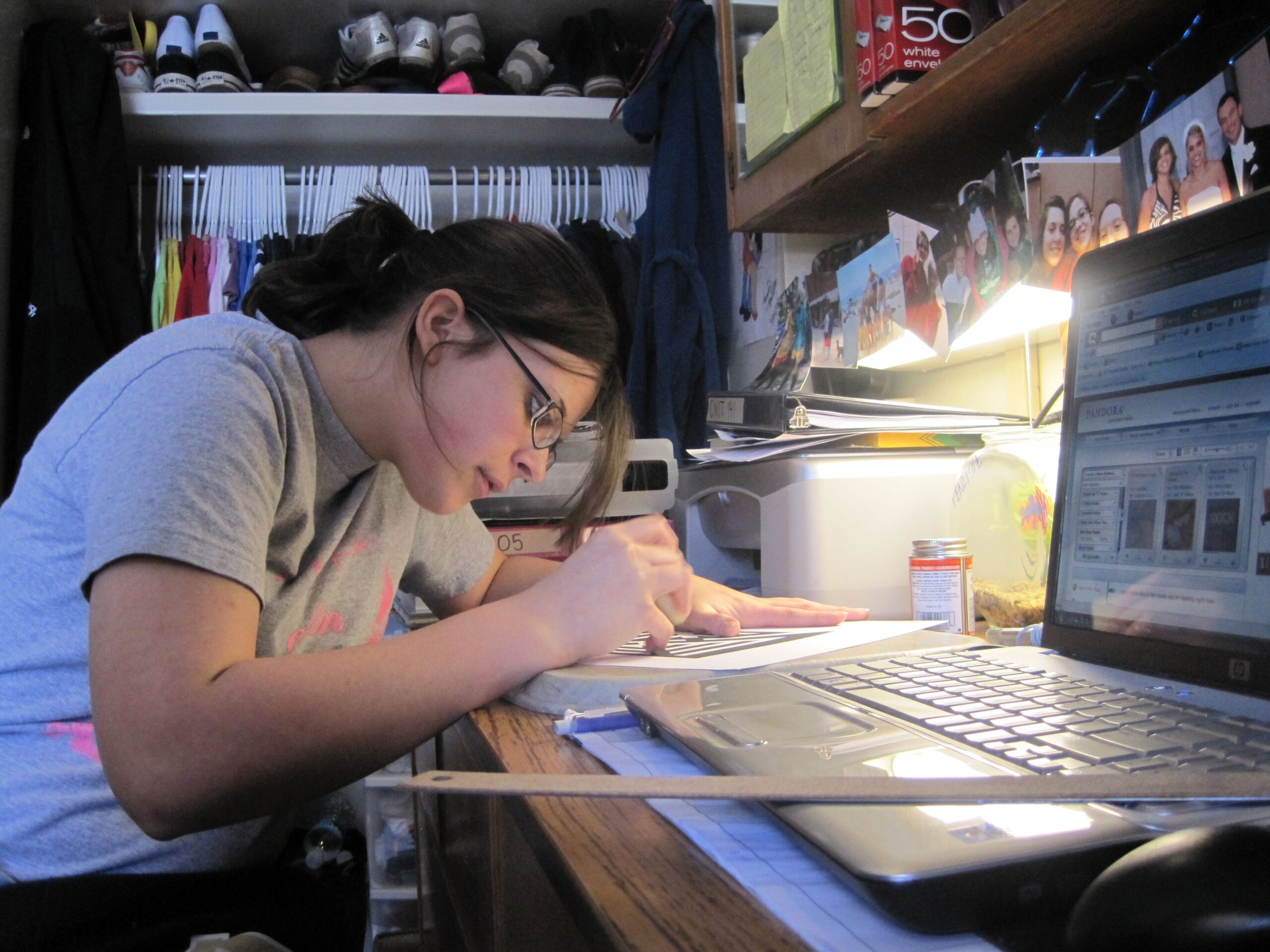 A student at a dorm room desk, representing the small routines that make college move-in easier.