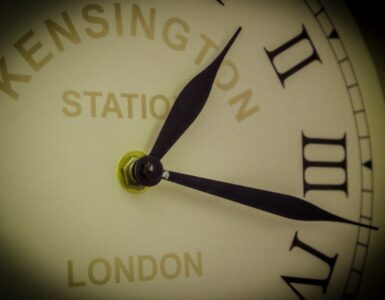 Close view of an analog clock face representing the one-hour daylight saving time change