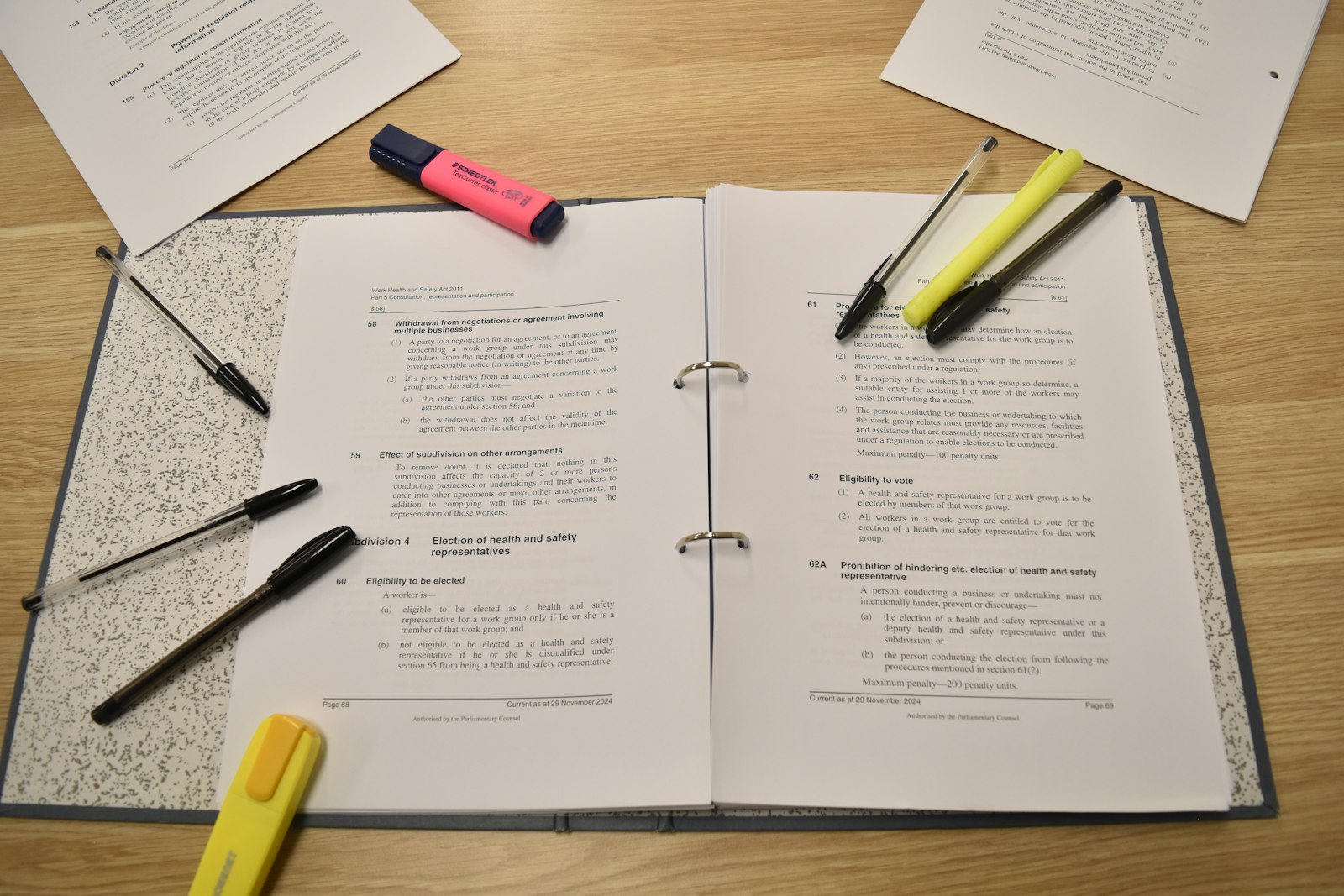 Open study notes with colorful pens, showing how ink flow and paper surface affect the written line.