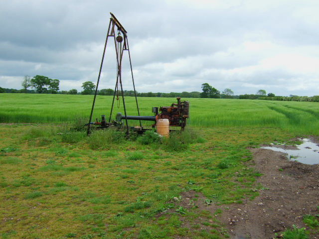 Groundwater irrigation pump beside a rural field
