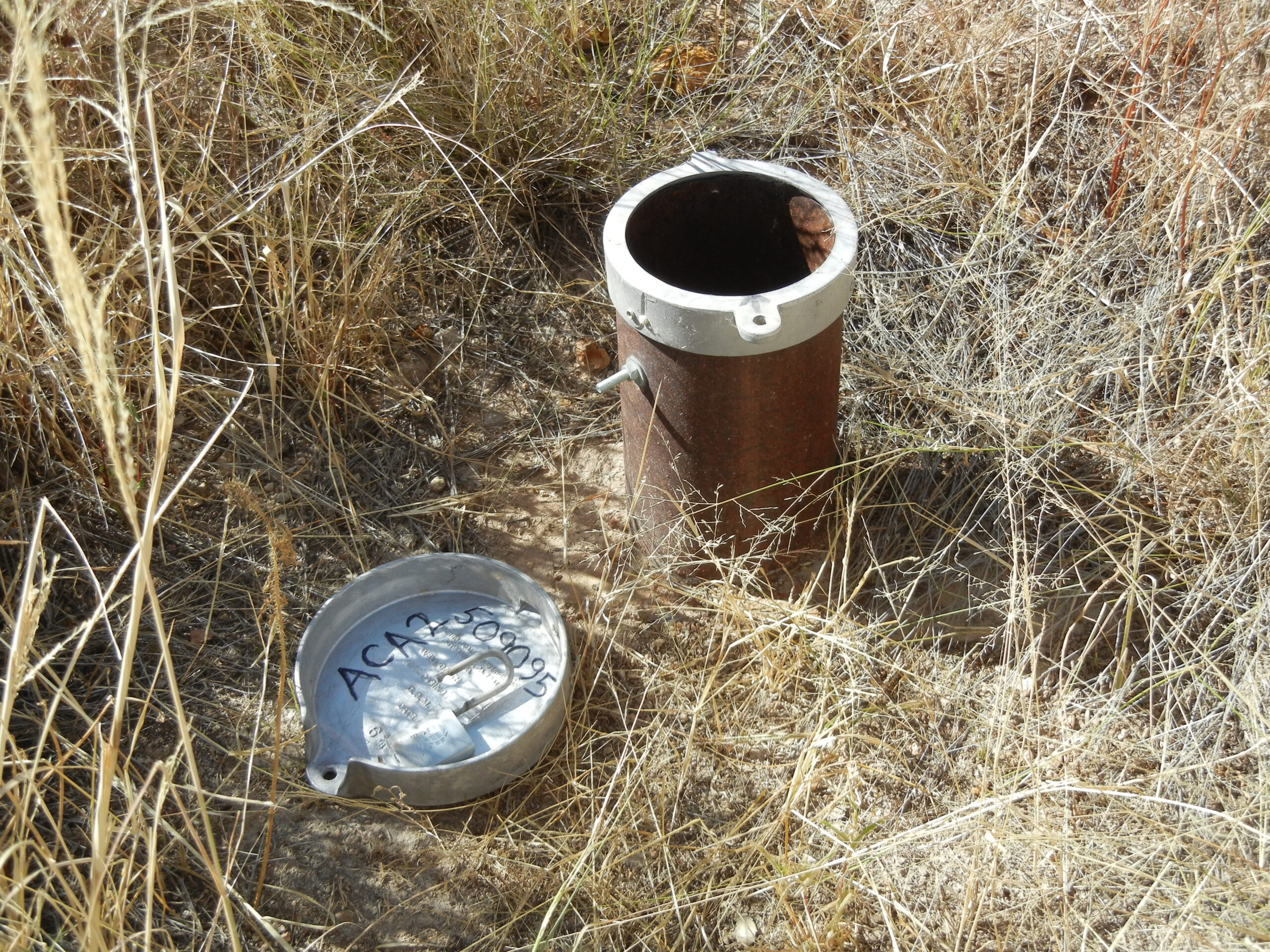 Groundwater monitoring well in a dry landscape
