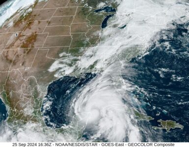 Satellite image of a hurricane near the southeastern United States before land interaction begins to weaken its circulation.