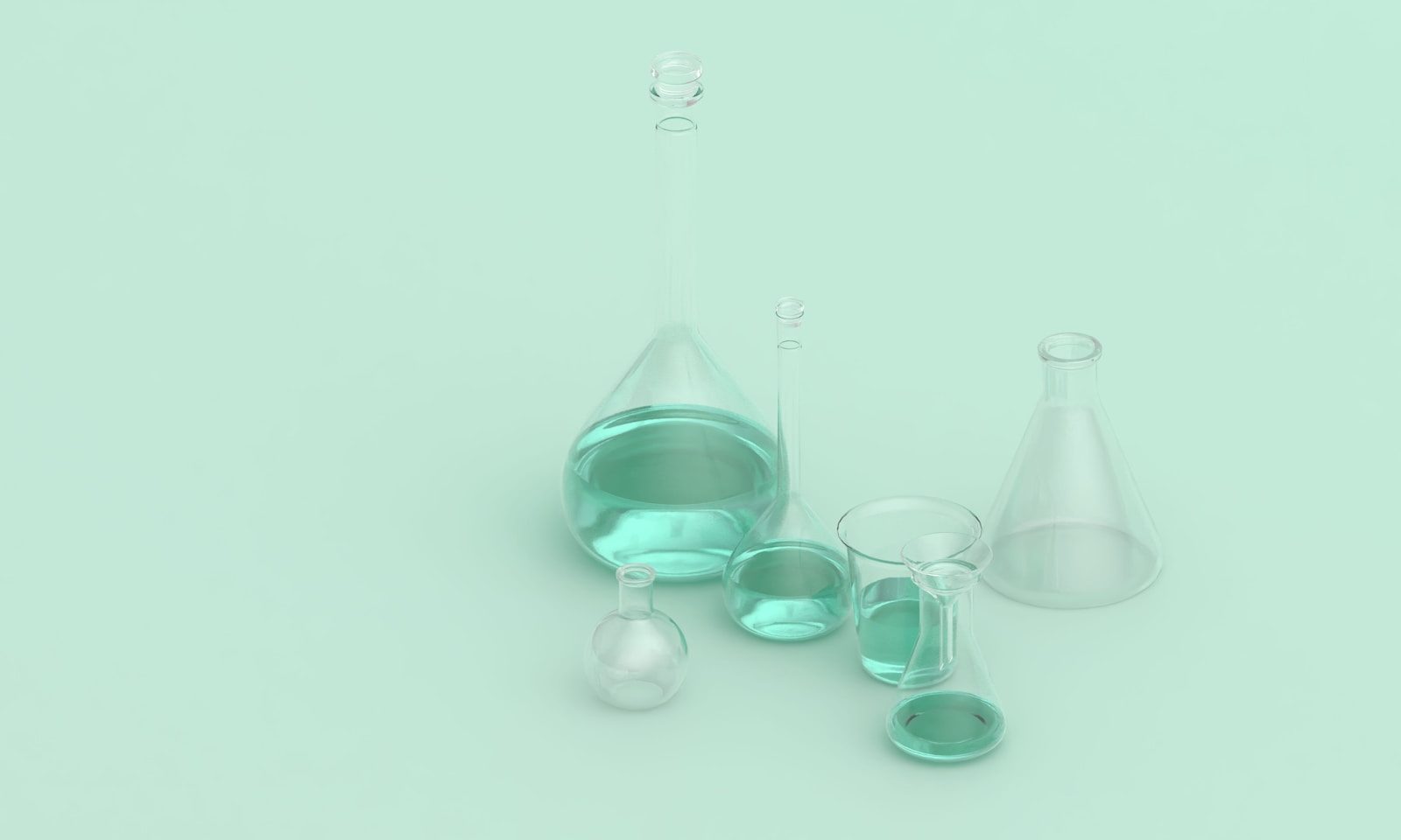 Beakers and flasks arranged for a chemistry experiment where students should check hazards before handling materials.