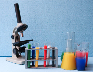 Chemistry laboratory equipment on a lab bench, representing safety symbols and hazard information students should read before an experiment.