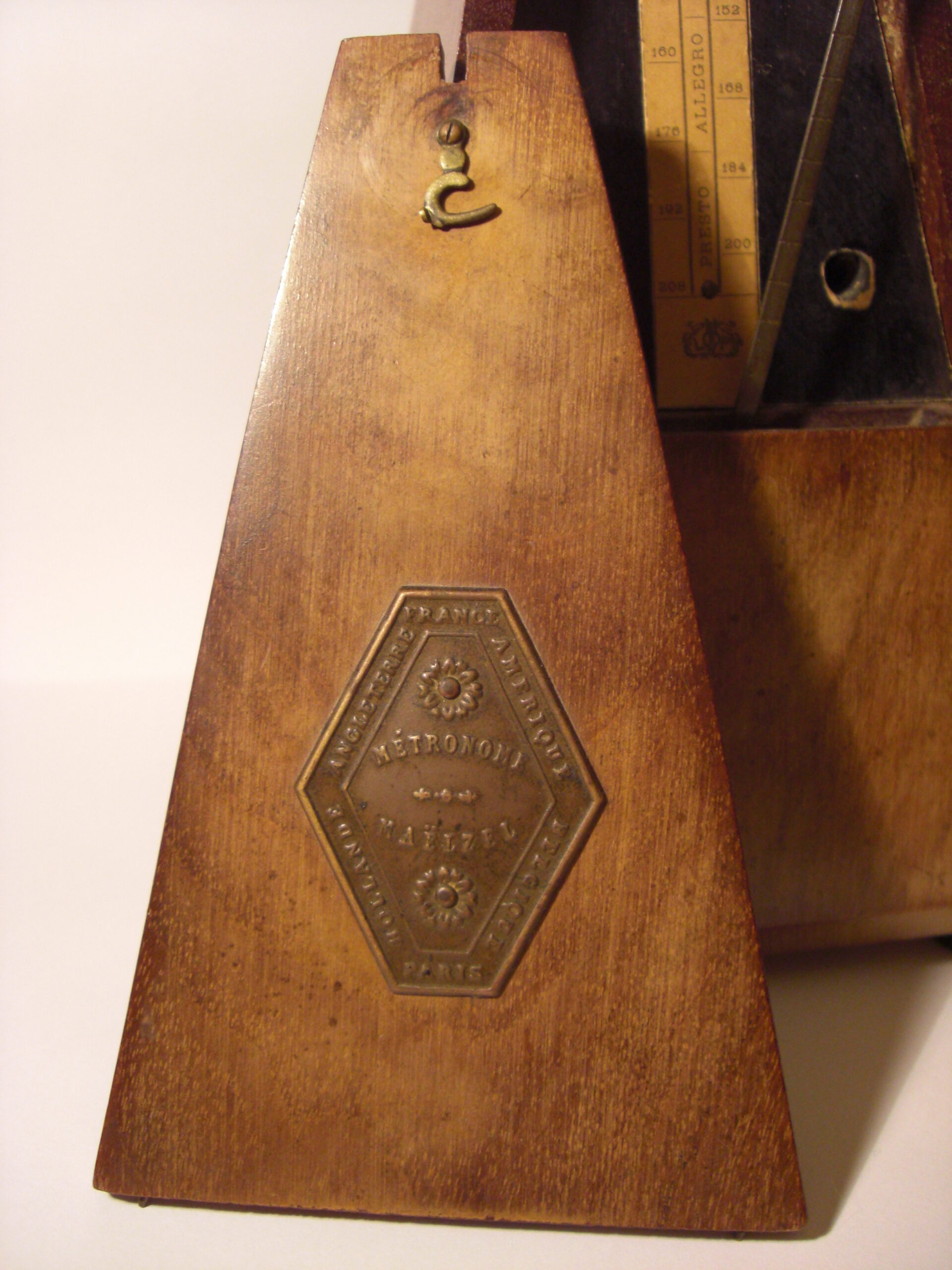 A mechanical metronome used to keep a steady beat during music practice.