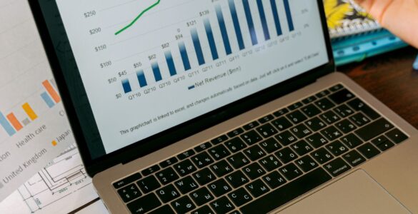 A laptop screen with charts, representing how percentage points and percent change can tell different stories in data.