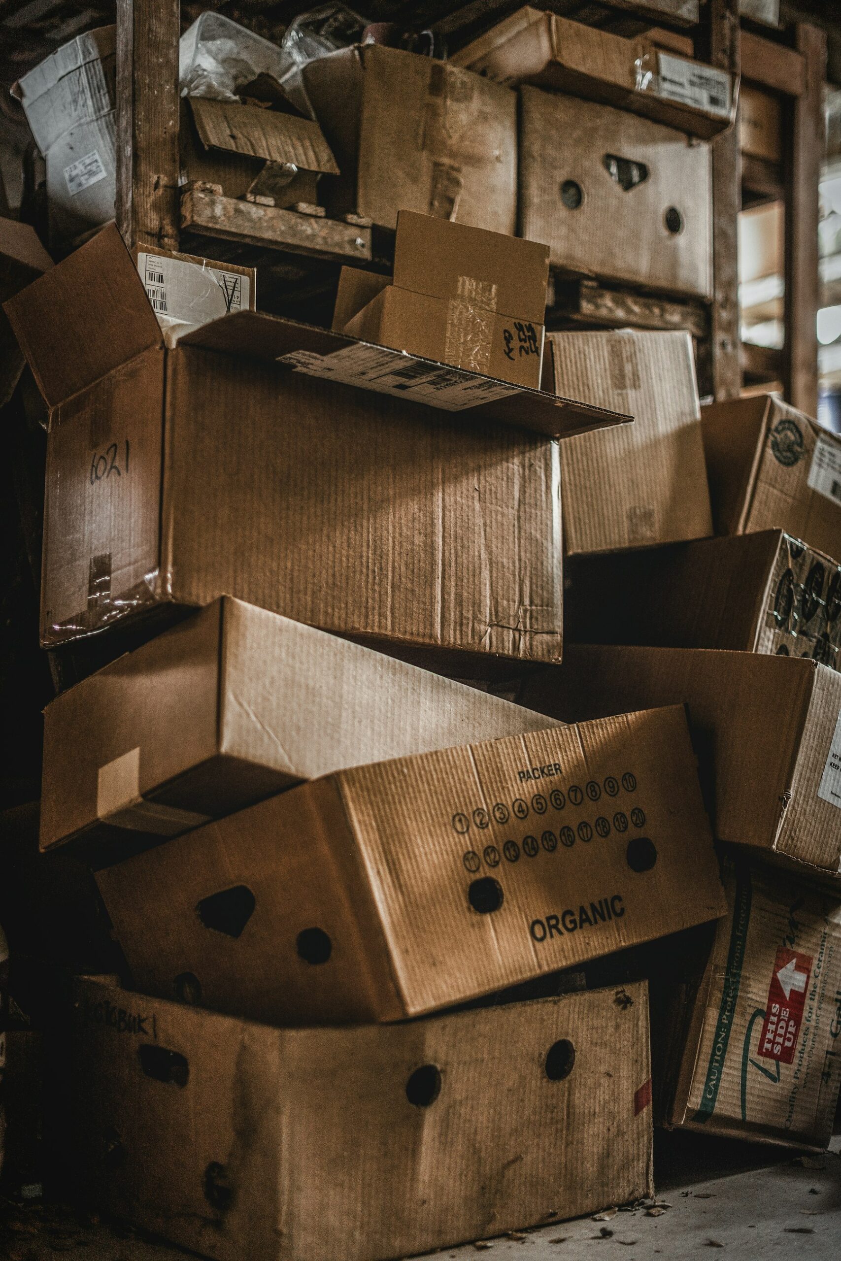 Stacks of cardboard boxes in a warehouse, representing inventory that changes before holidays and shopping seasons.