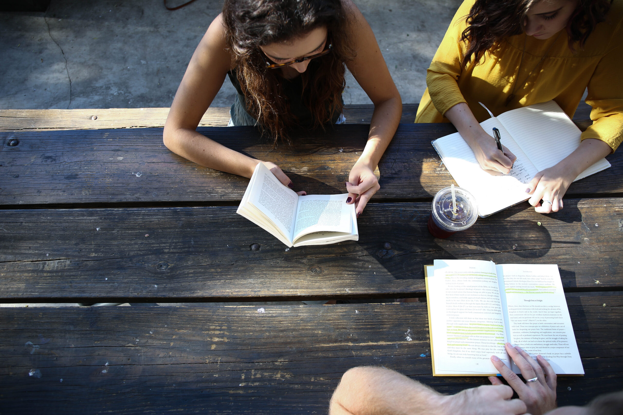 Students discuss schoolwork together, showing how nearby classmates can shape participation and peer learning.