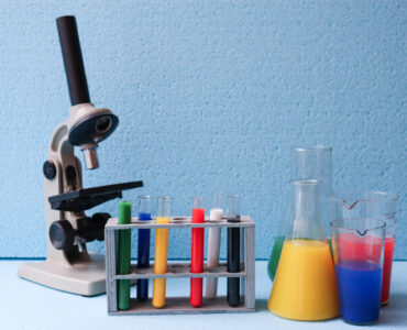 Laboratory equipment on a bench used for careful scientific measurement and significant figures.