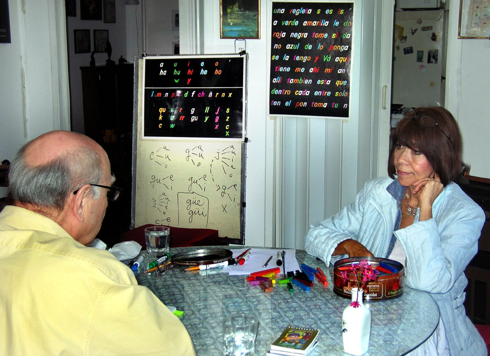 A student works through a one-on-one Spanish language lesson in a classroom.