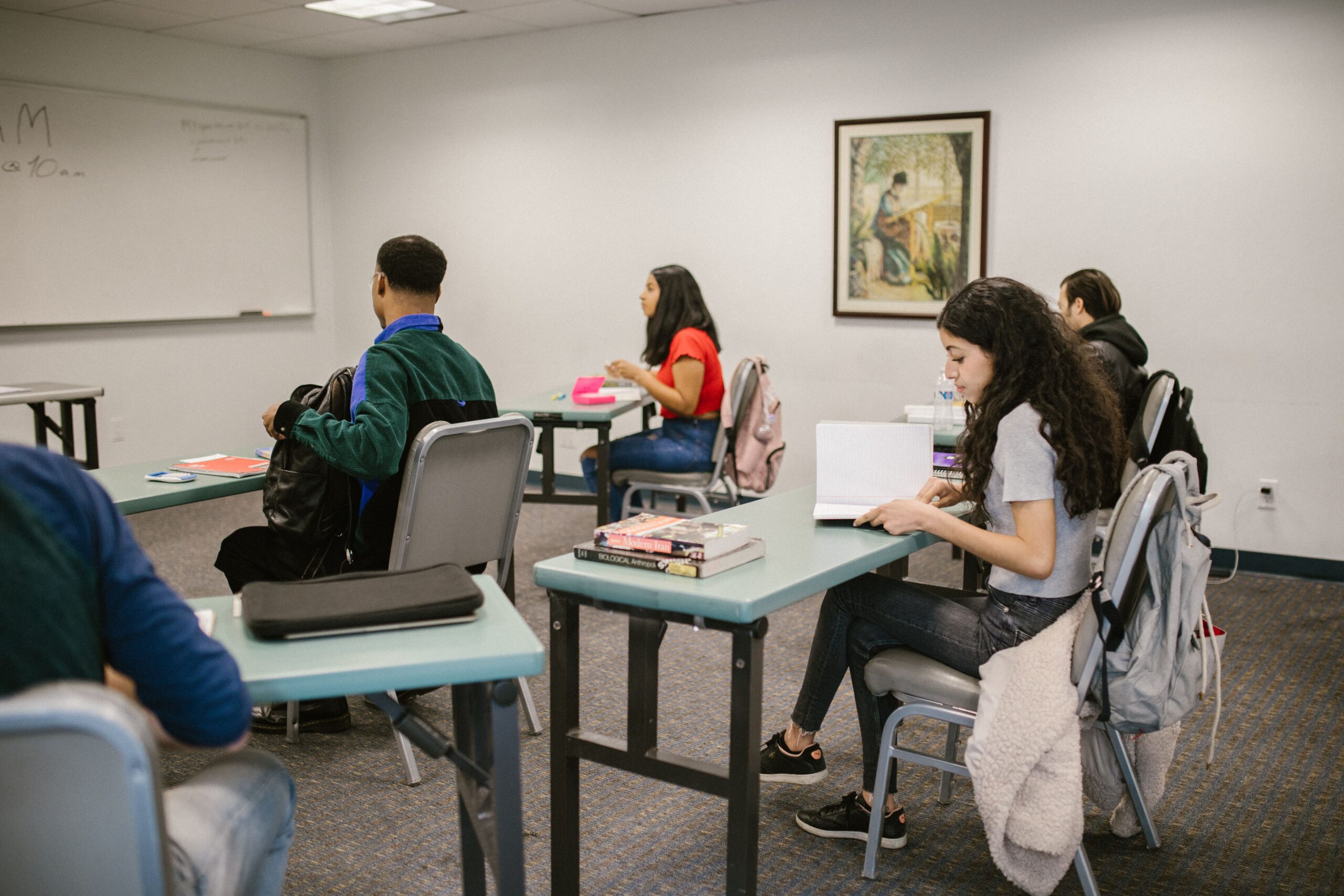 Students practicing Spanish stem-changing verb forms in a language classroom