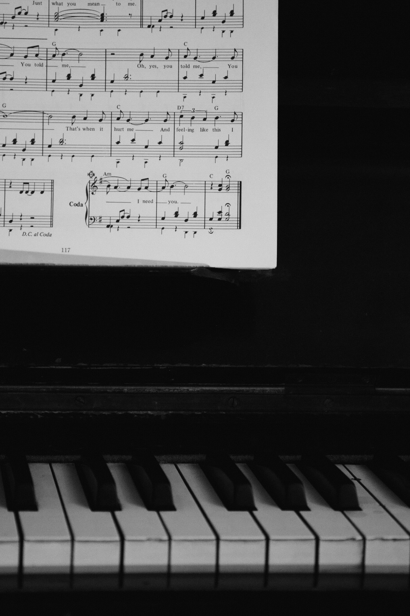 Sheet music and piano keys used for practicing rhythm, tempo, and steady beat.