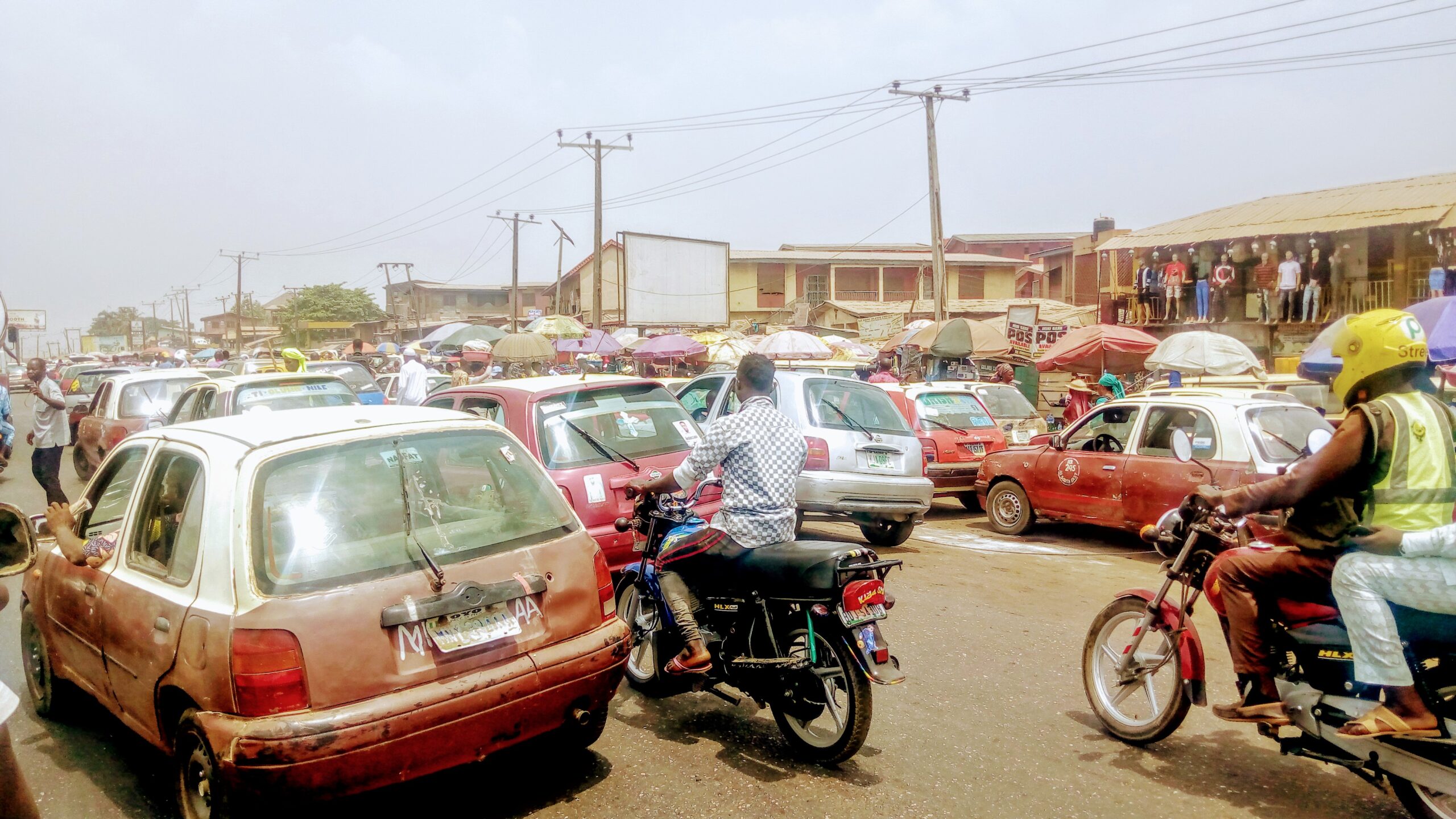 Cars lined up in dense stop-and-go traffic on a busy roadway