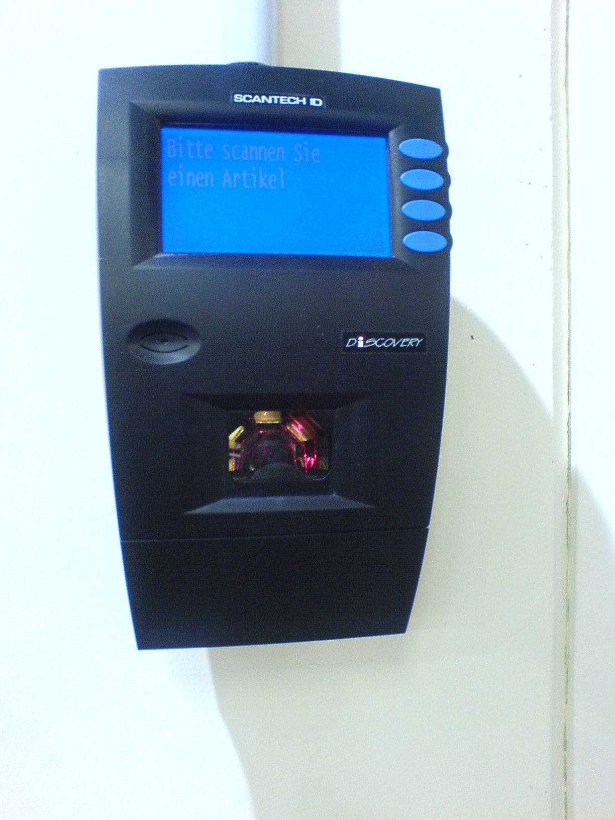 A barcode scanner, representing the optical scanning used on many student ID cards for library or cafeteria systems.