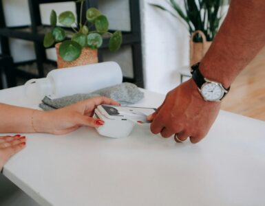 A card being tapped on a reader, representing how student ID cards can connect to campus services and access systems.