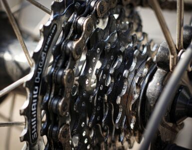 Close-up of a bicycle chain resting on several rear cassette gears