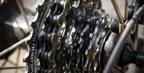 Close-up of a bicycle chain resting on several rear cassette gears