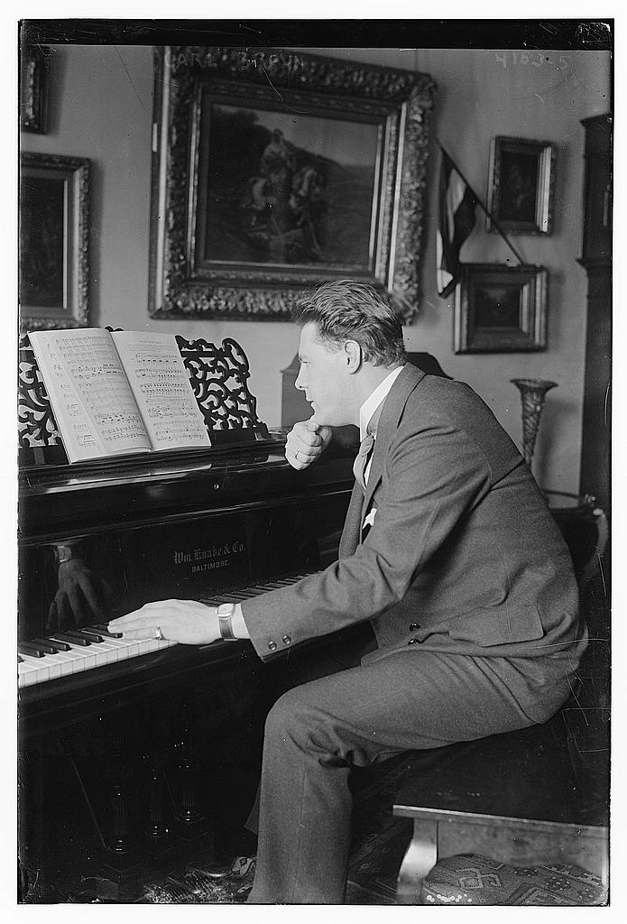 Musician Carl Braun seated at a piano