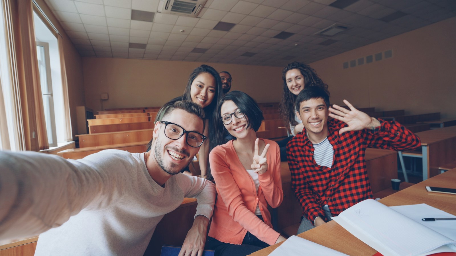 A group of students together in a classroom