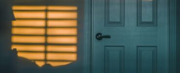 A quiet bedroom at night, where closing the door can slow the spread of smoke and heat during a house fire.