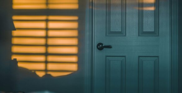 A quiet bedroom at night, where closing the door can slow the spread of smoke and heat during a house fire.