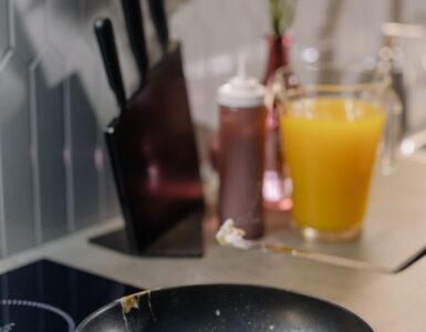 An egg cooks in a pan as heat turns liquid proteins into a firmer white and yolk.