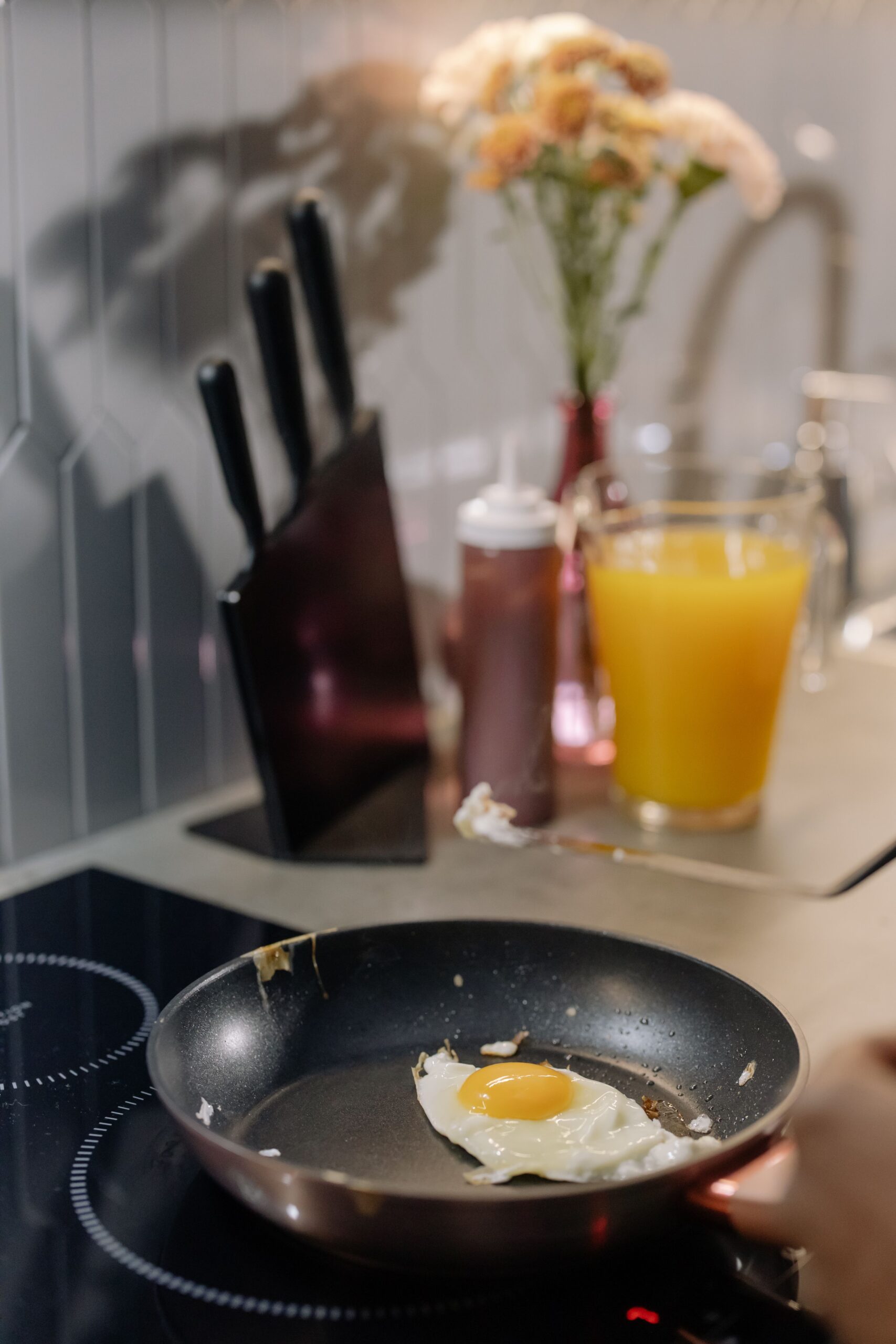 An egg white turns opaque in a pan as proteins unfold, link together, and scatter light.
