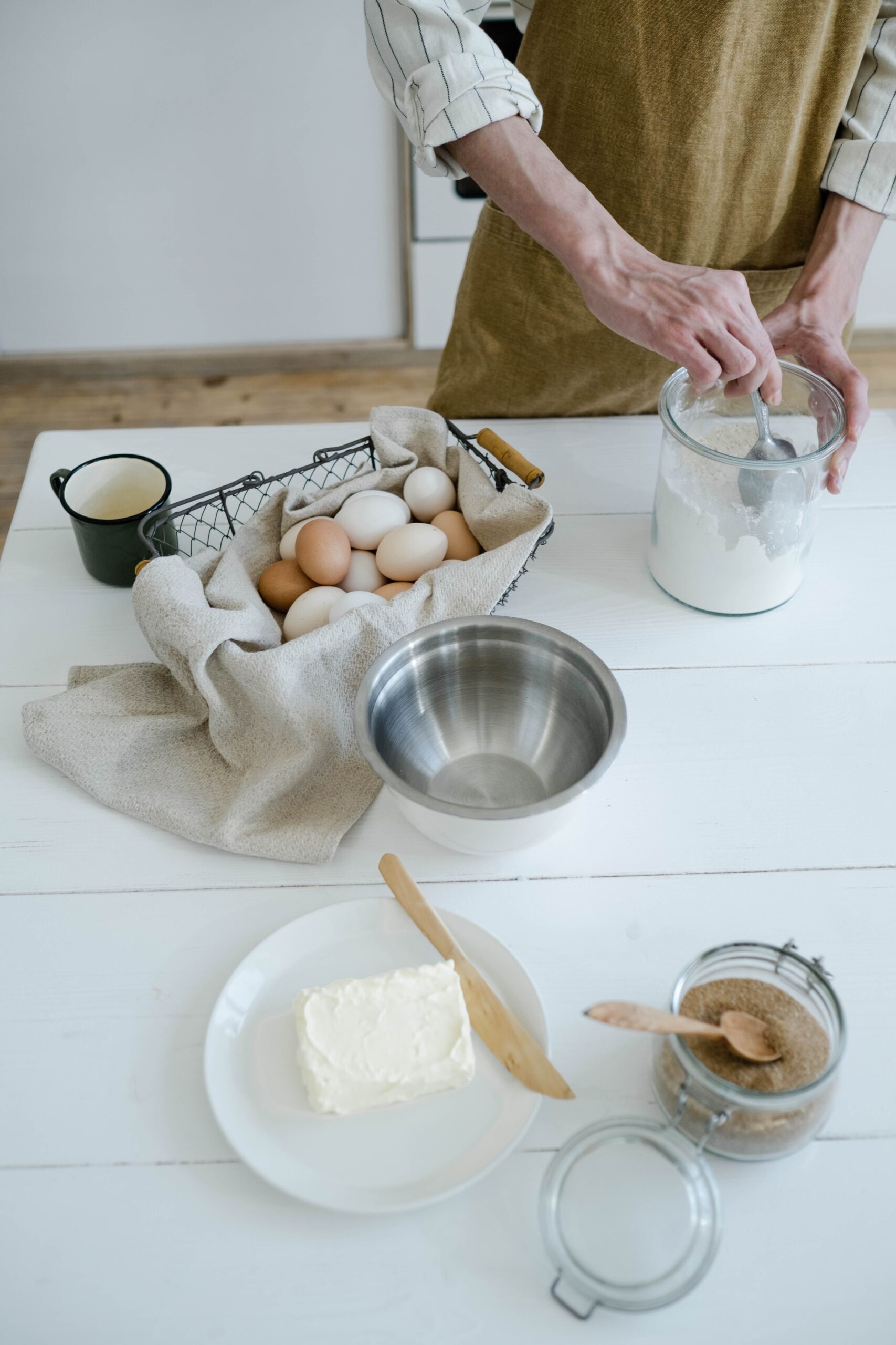 Raw eggs sit with baking ingredients before cooking changes their proteins and texture.