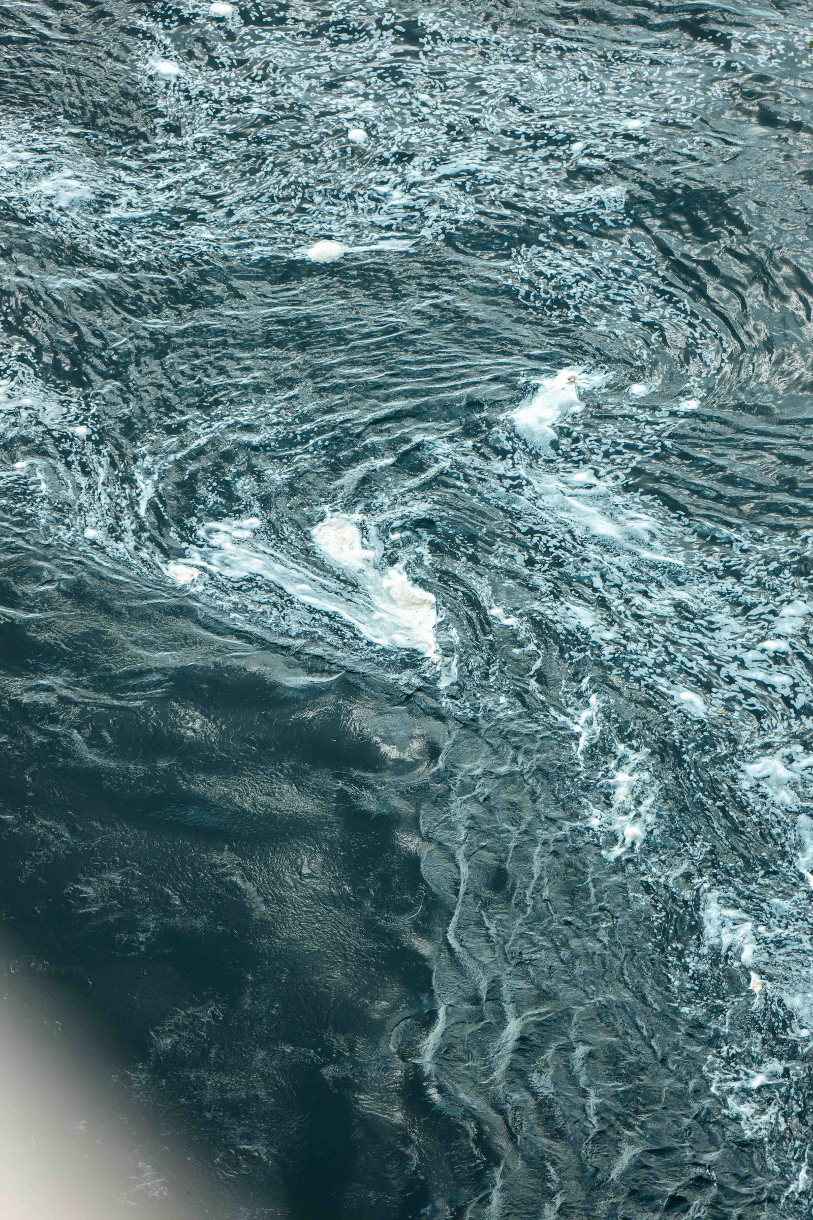 Aerial view of ocean surface patterns that can reflect changing currents and temperature conditions.