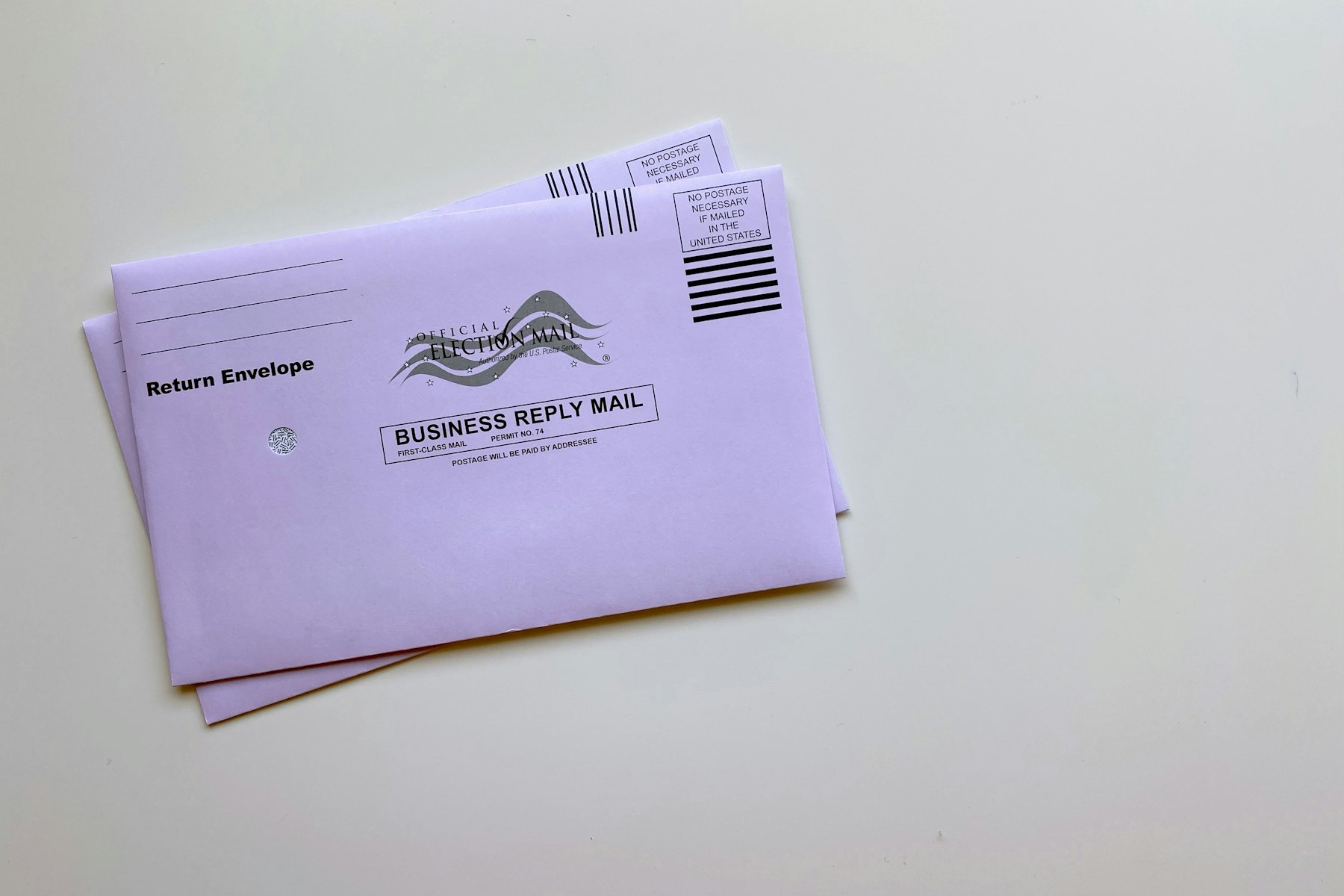 Mail ballot envelopes arranged on a table for an election