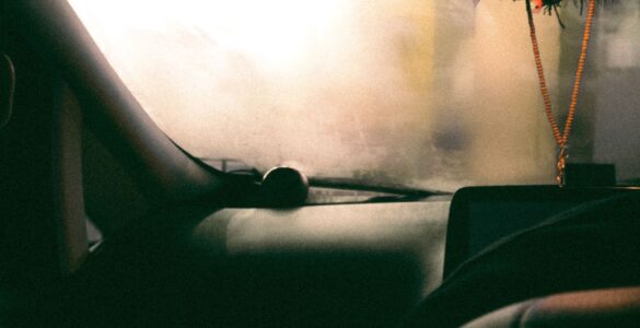 Fogged windshield obscuring the view from inside a parked car
