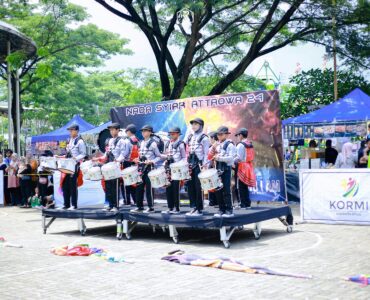 A marching band performs together outdoors in coordinated formation.