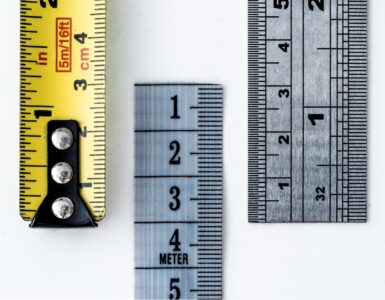Rulers and measuring tapes marked in centimeters, millimeters, and inches