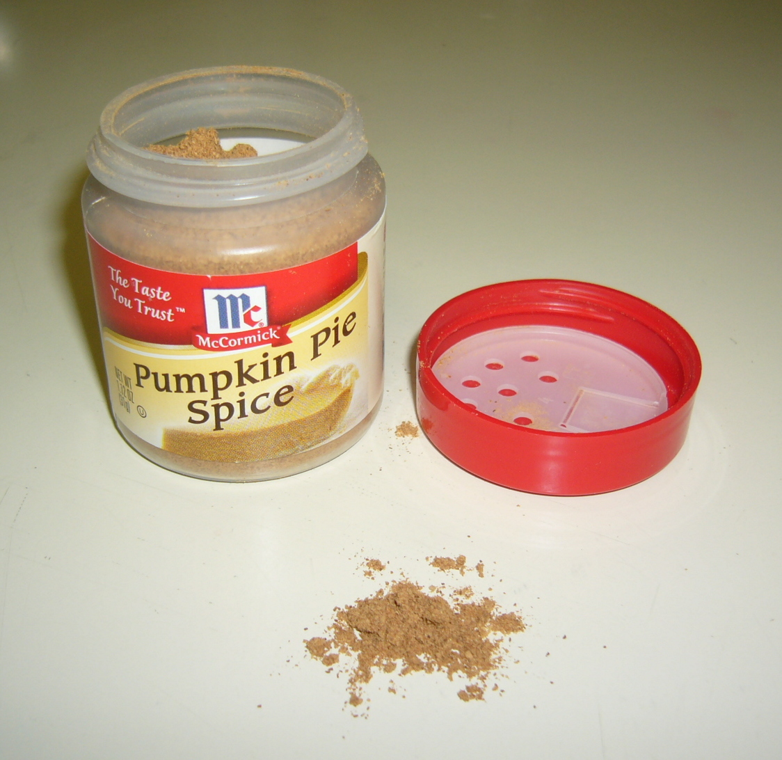 A close view of pumpkin pie spice powder with warm brown color and fine texture.