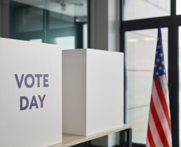 Voting booths set up for an election where voters may need to choose between finalists in a runoff.