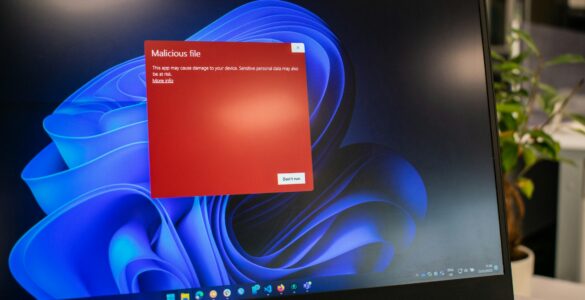 Laptop displaying a red security warning screen