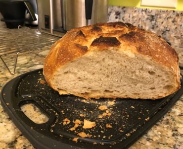 Sliced loaf of sourdough bread showing its soft crumb