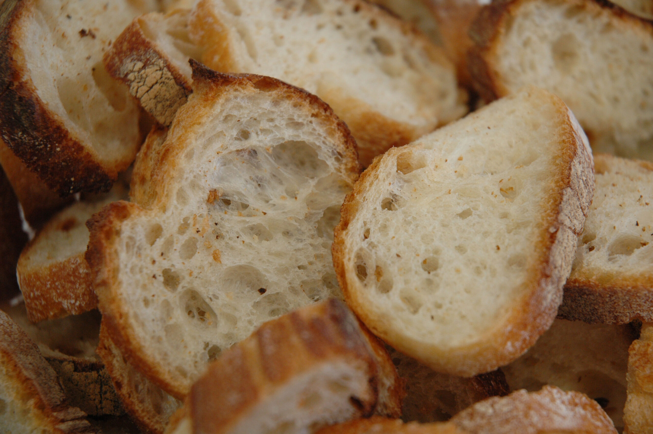 Several slices of bread showing the structure of the crumb