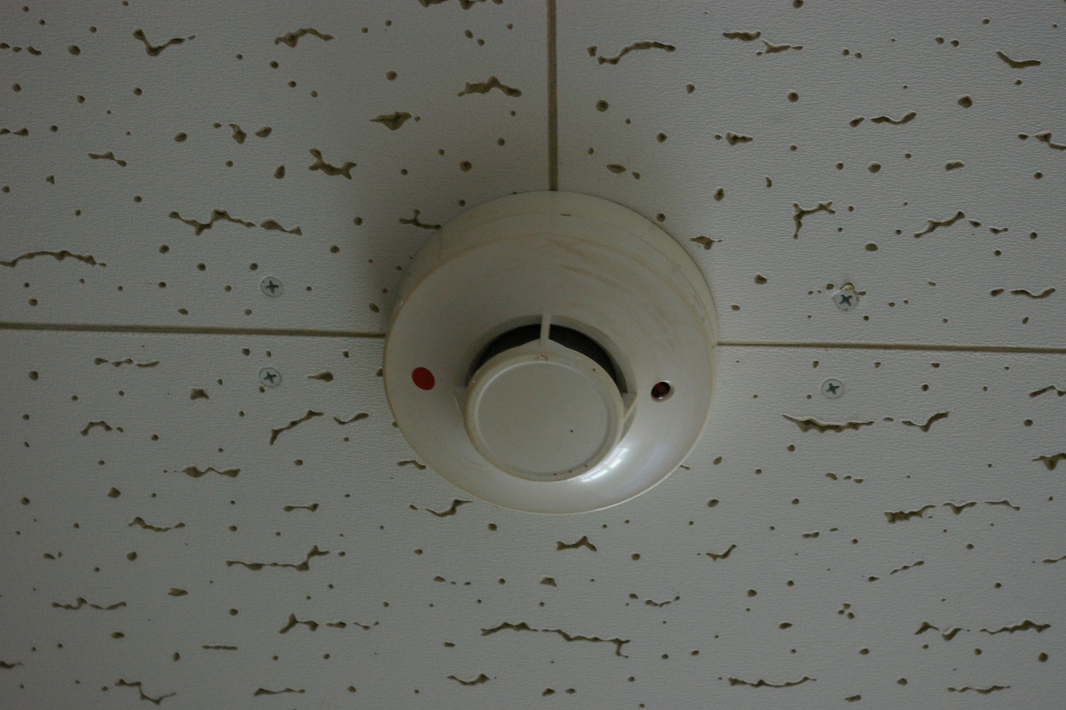 A photoelectric smoke alarm used to warn sleeping occupants about a fire.