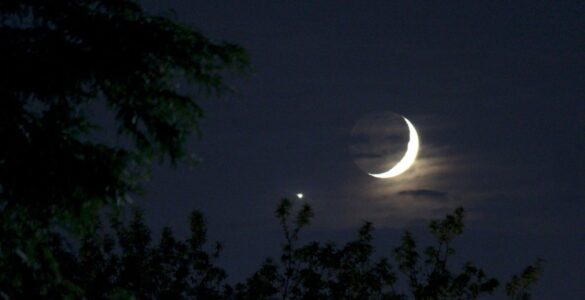 Bright Venus shining beside a thin crescent Moon in the evening sky.