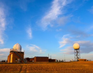 A weather radar station in an open field, representing the observations that help shape changing app forecasts.