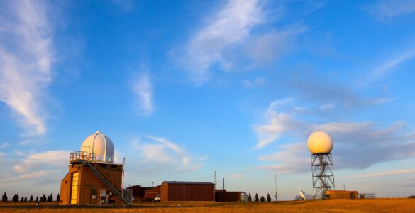 A weather radar station in an open field, representing the observations that help shape changing app forecasts.