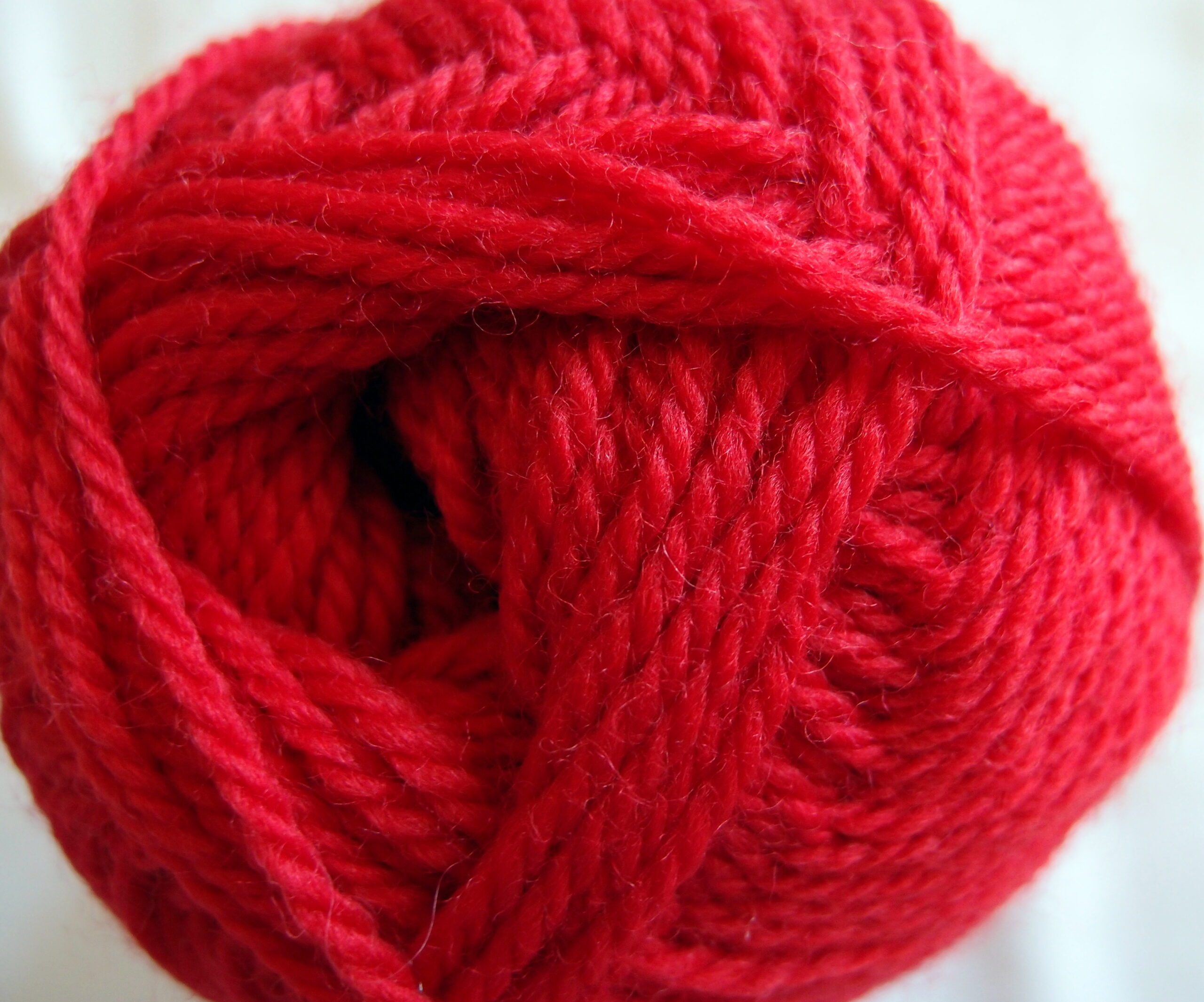Close-up of plied worsted wool yarn showing its twisted fibers
