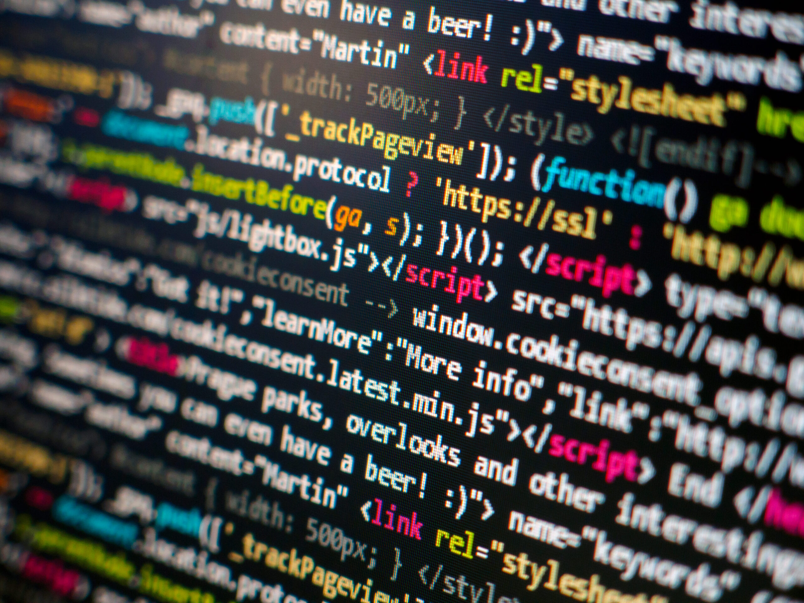 Programming code displayed on a monitor, representing the rules computers use to store and compare numbers.